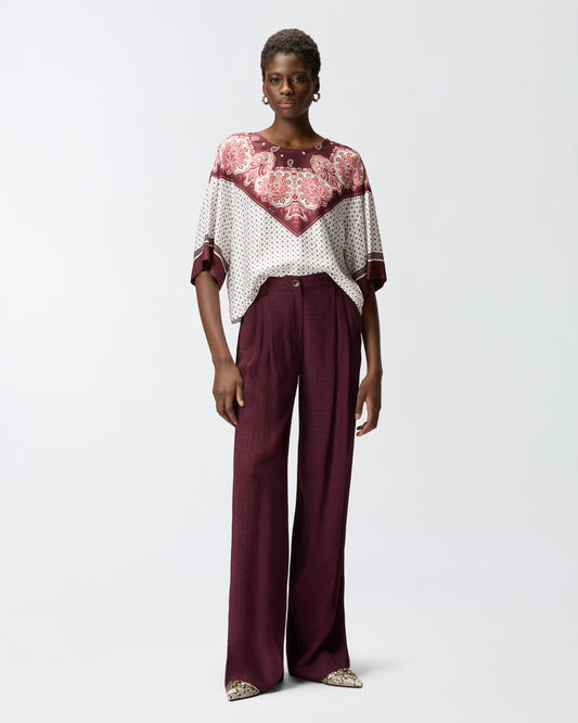 Blouse with tie motif and placed print
