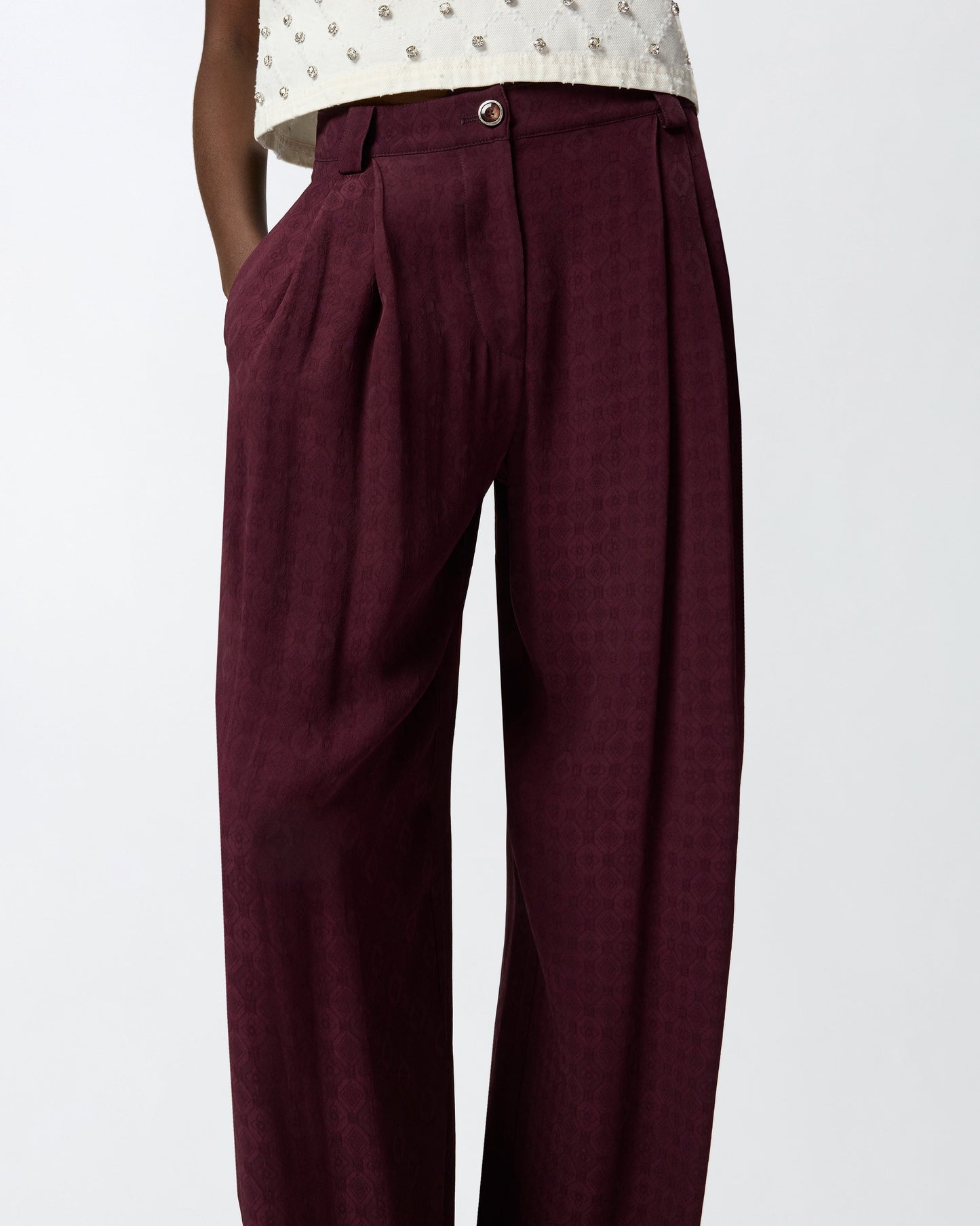 Trousers in jacquard with tie motif