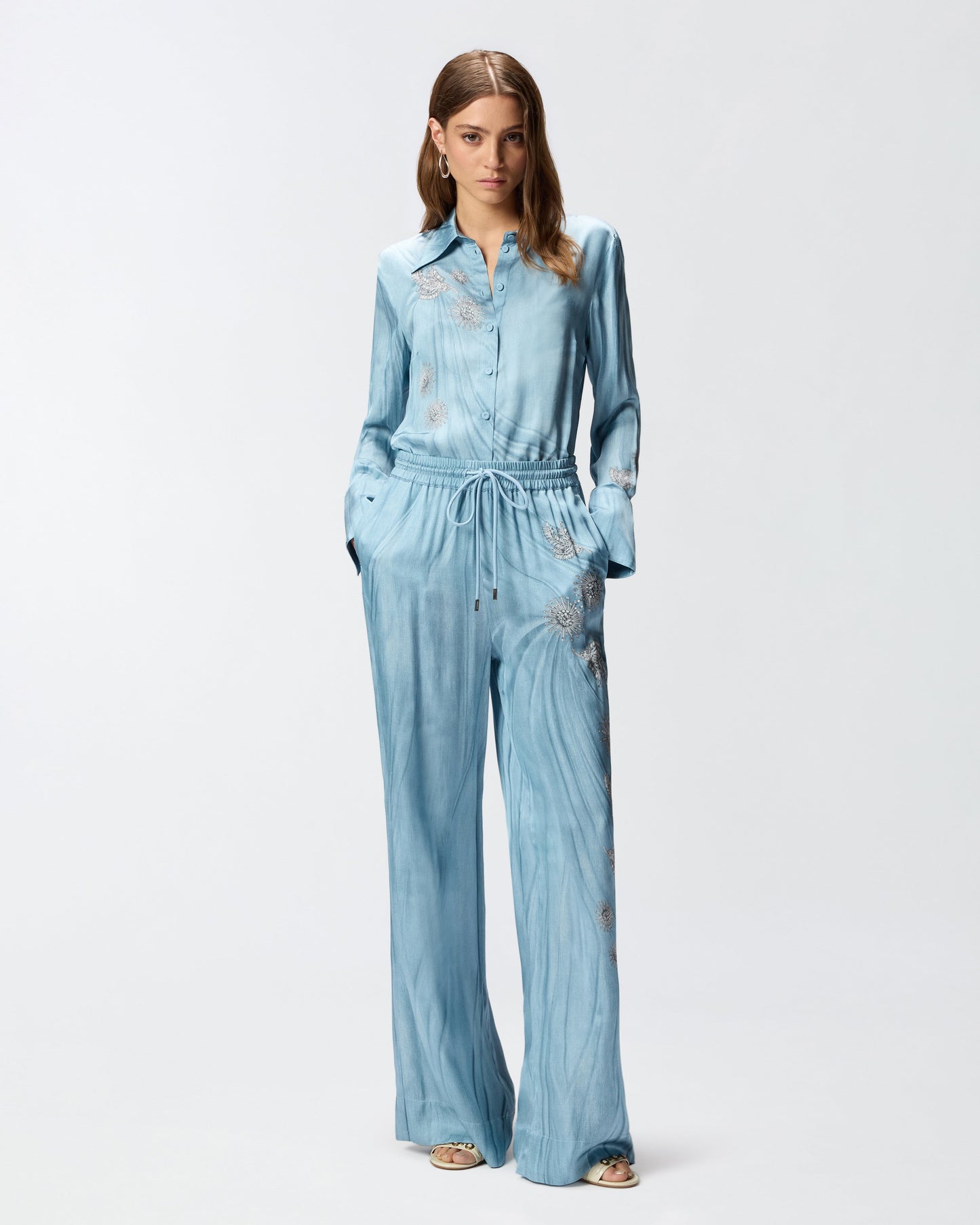 Fluid trousers with placed jewel print
