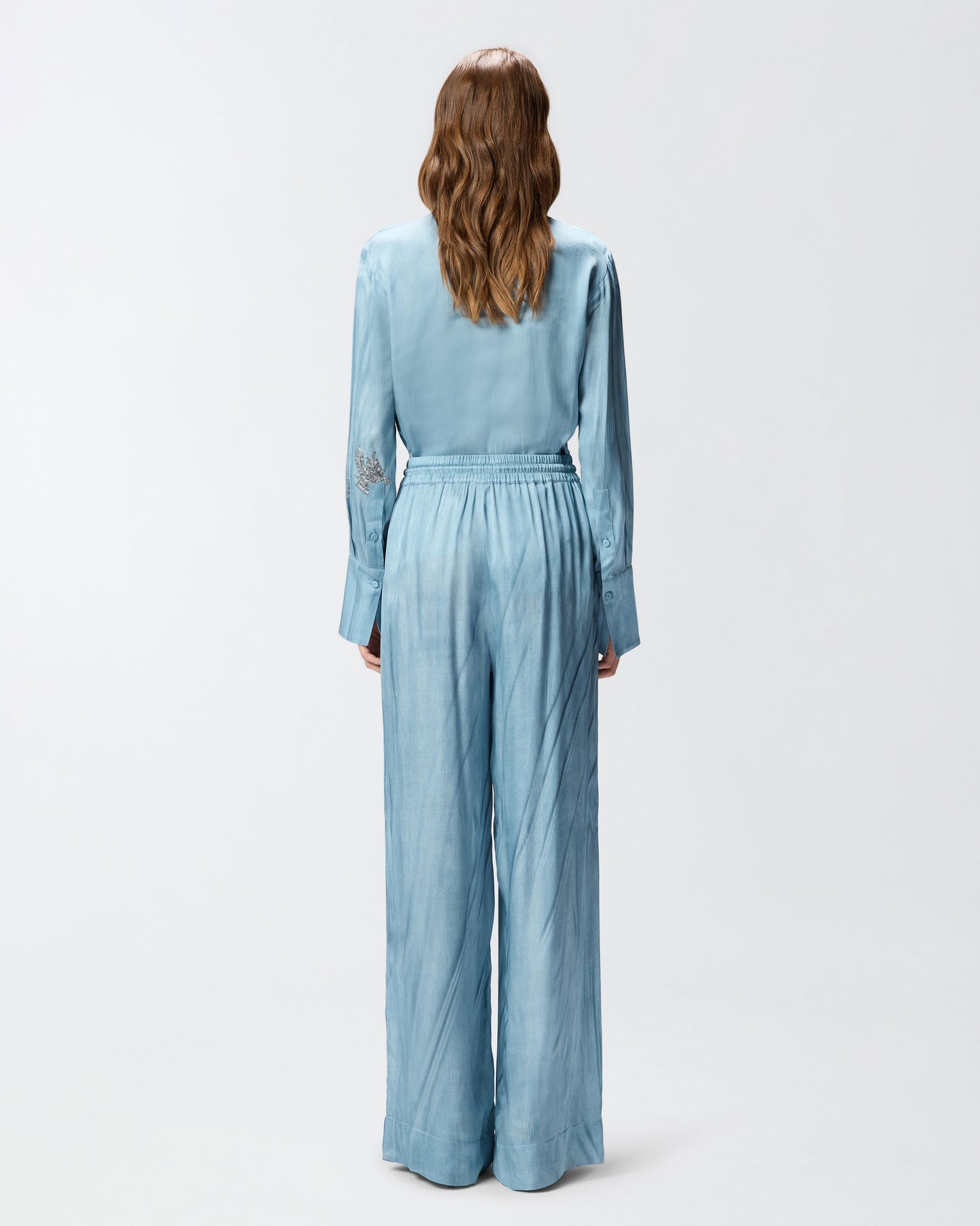 Fluid trousers with placed jewel print