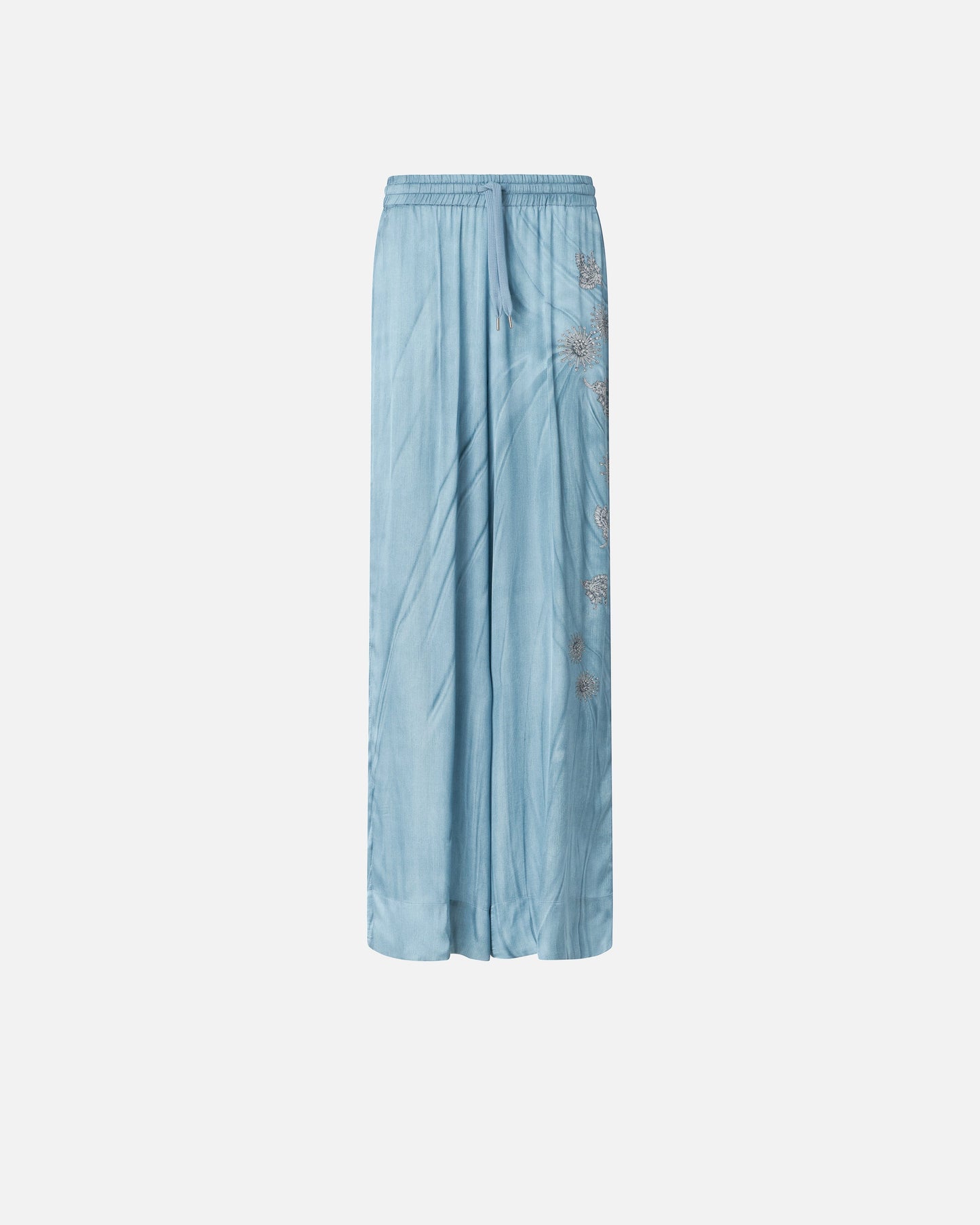 Fluid trousers with placed jewel print
