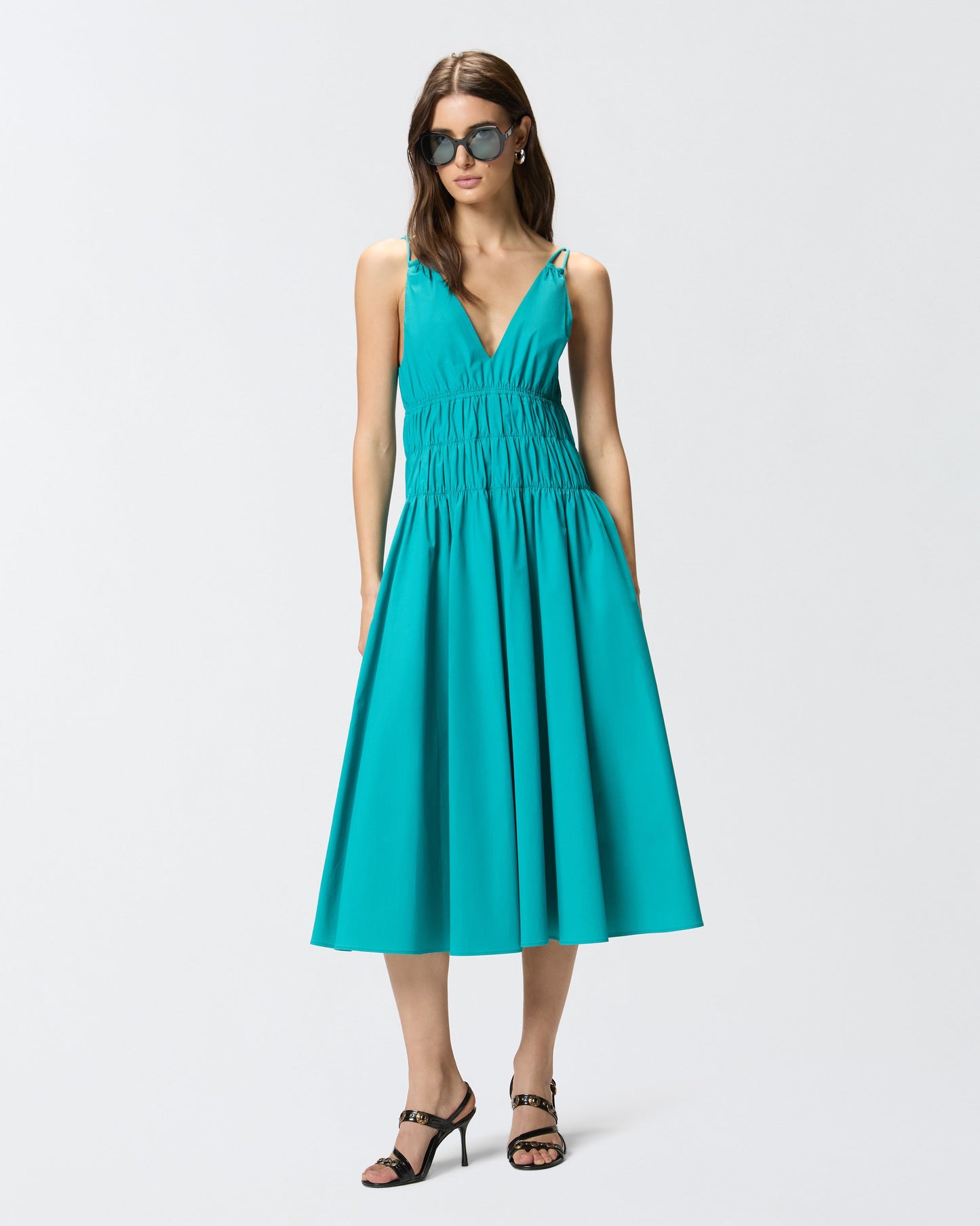 Sleeveless midi dress with pleats and gathering