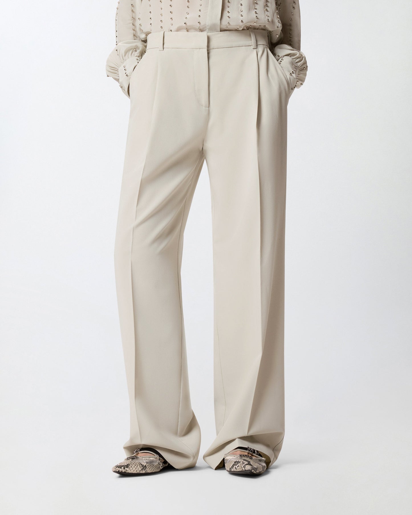Flowing trousers with pressed pleat detail