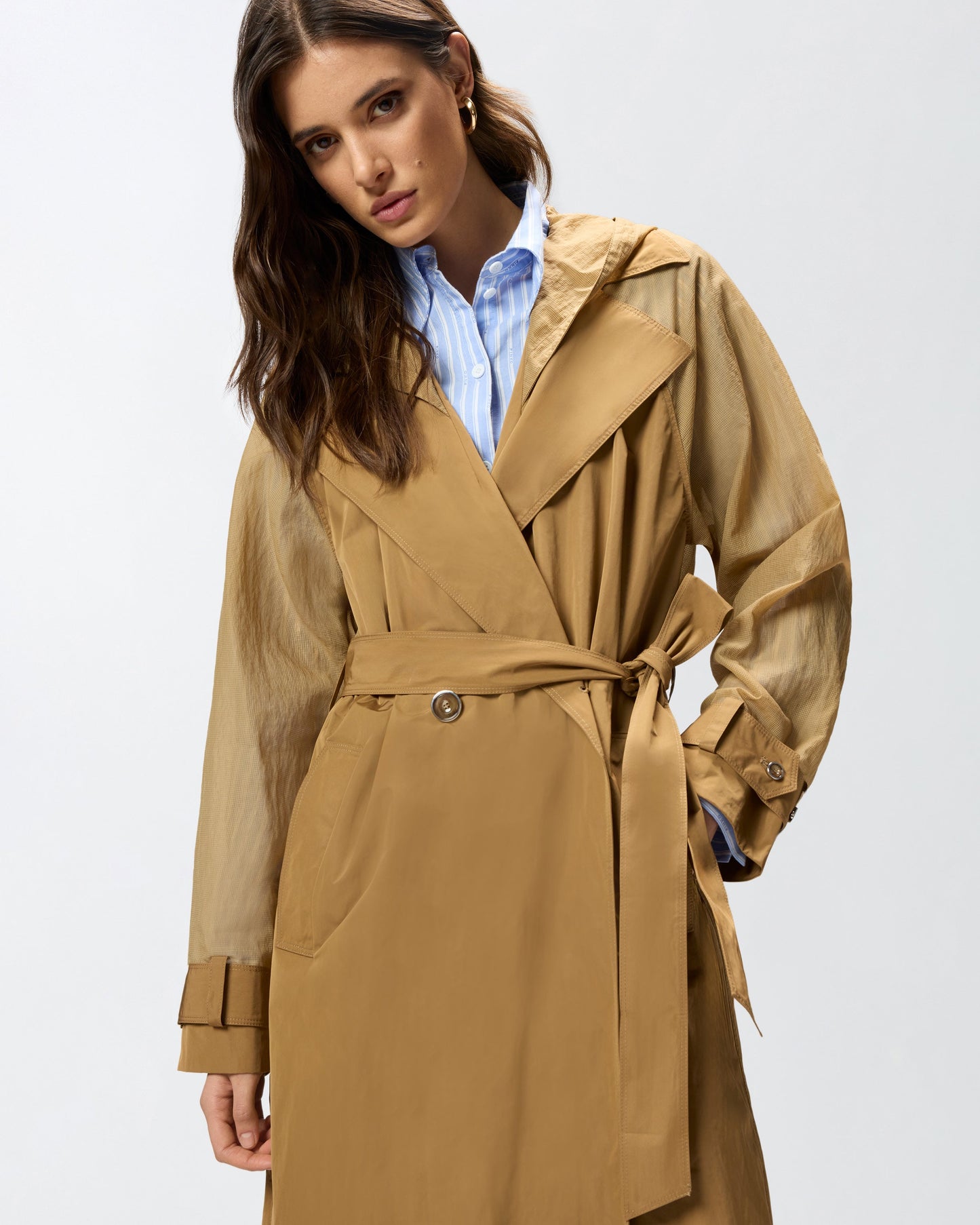 Trench coat with sheer inserts