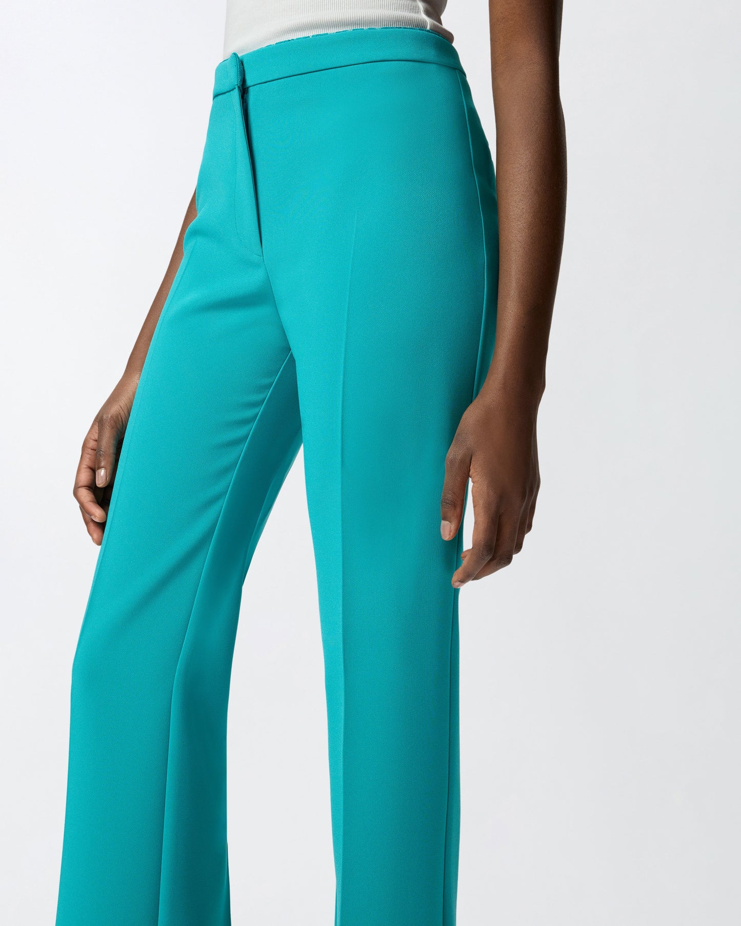 Trousers with pressed pleat detail