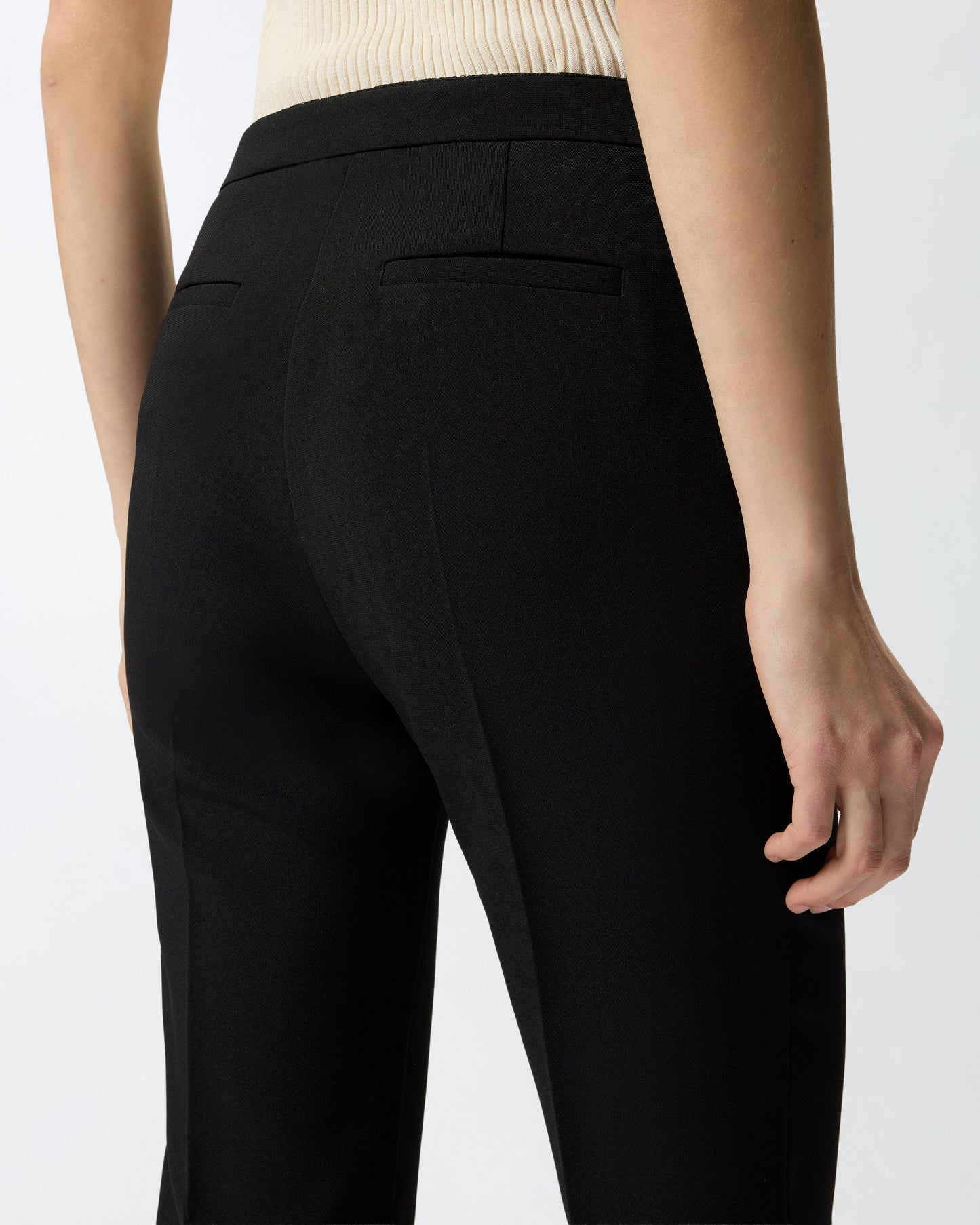 Trousers with pressed pleat detail
