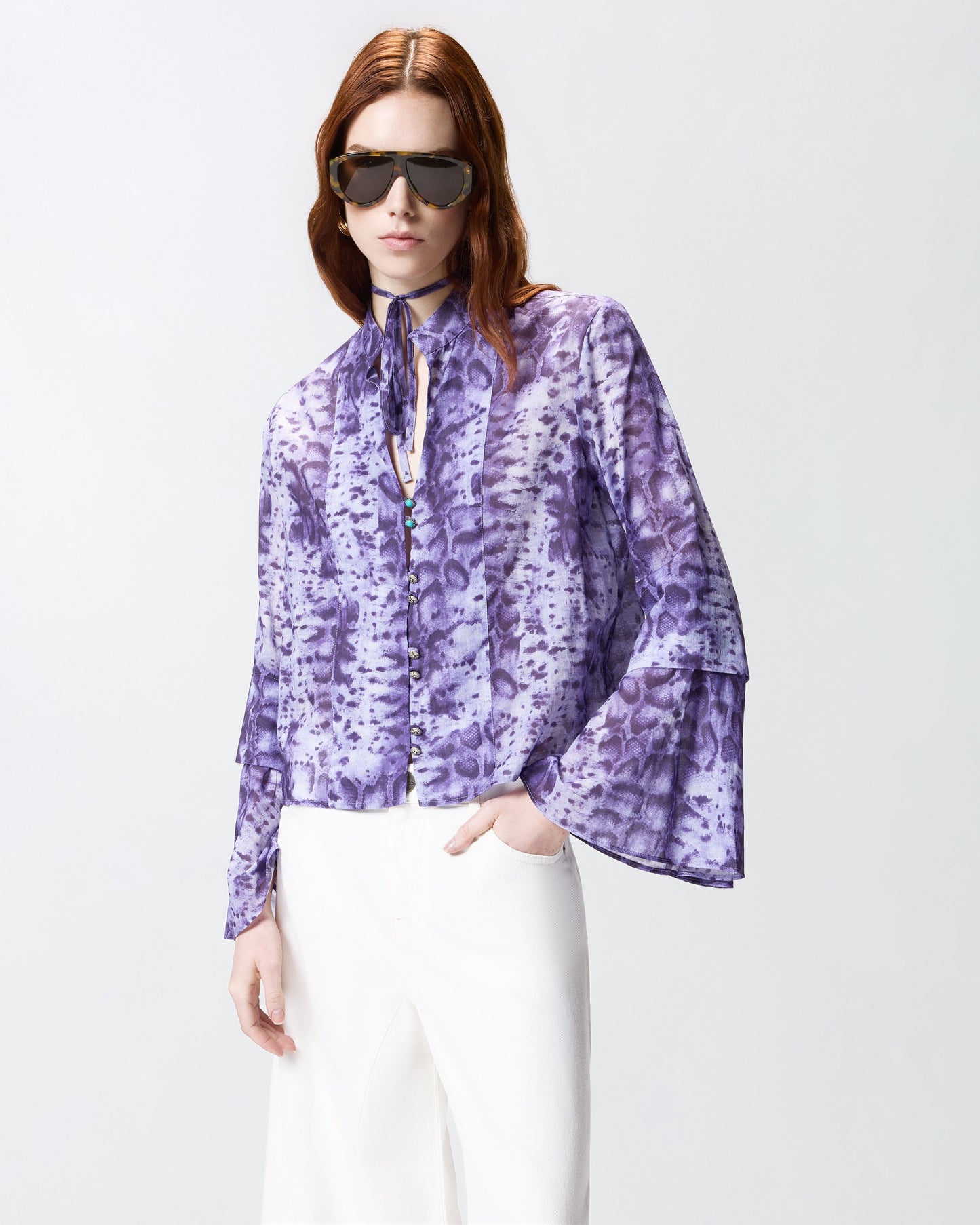 Blouse with snake print and jewel buttons