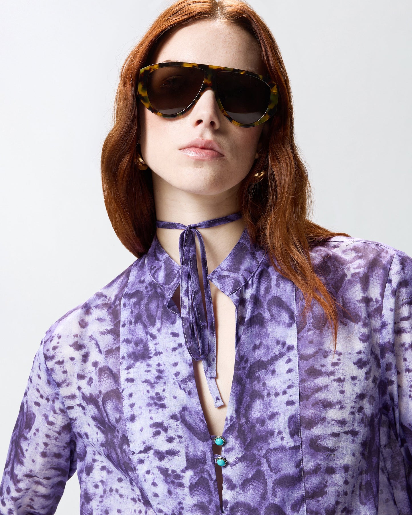 Blouse with snake print and jewel buttons
